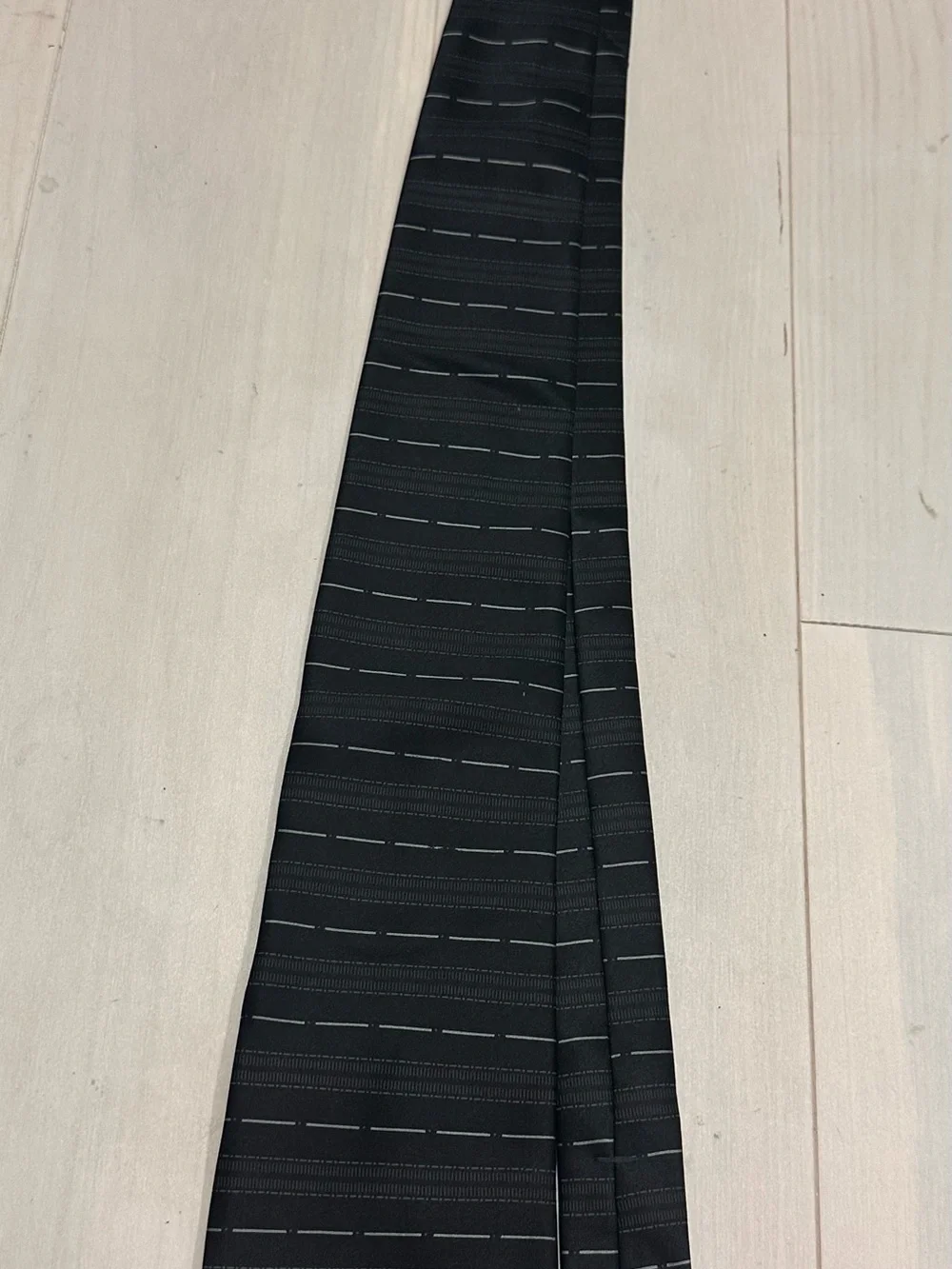 Men's Black Patterned Necktie with Subtle Gray Dash Lines